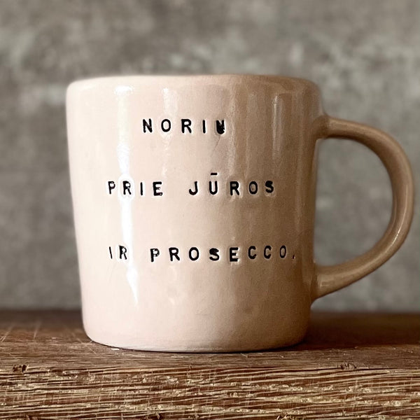 Pale pink mug with prosecco saying