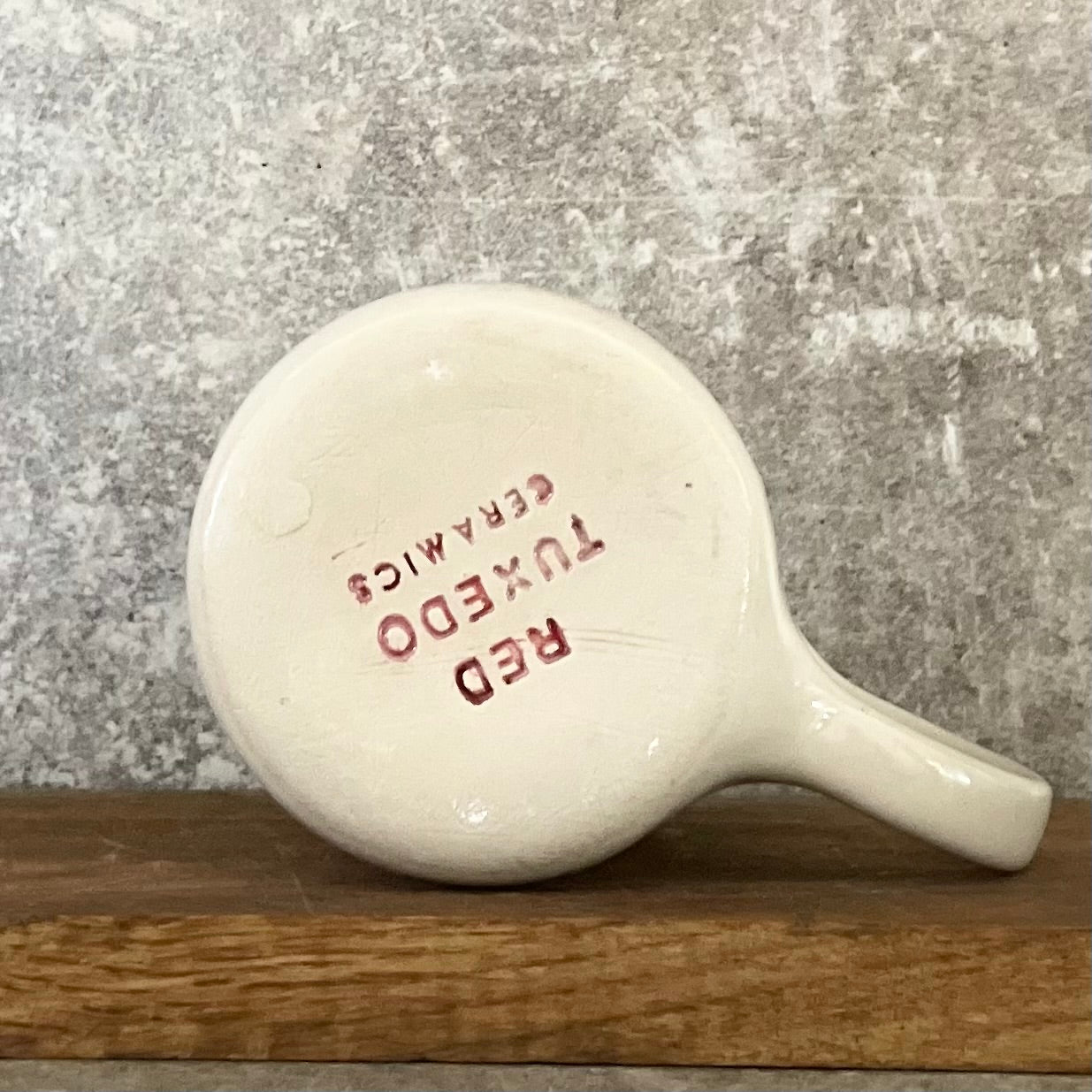 Pale pink ceramic mug with word LĖTAI