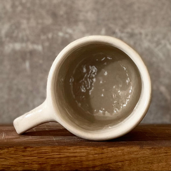 Ceramic mug with saying about magic