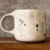 Ceramic mug with saying about magic