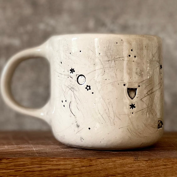 Ceramic mug with saying about magic