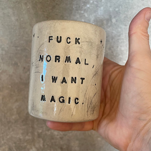 Ceramic tumbler mug with magic saying