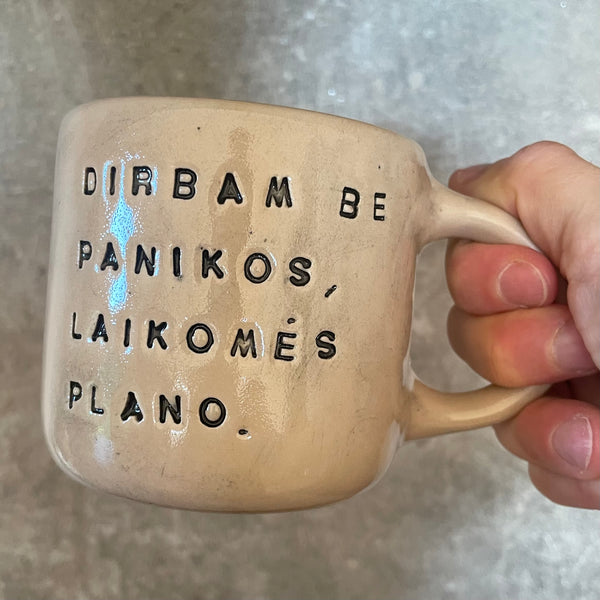 Ceramic mug with words about work