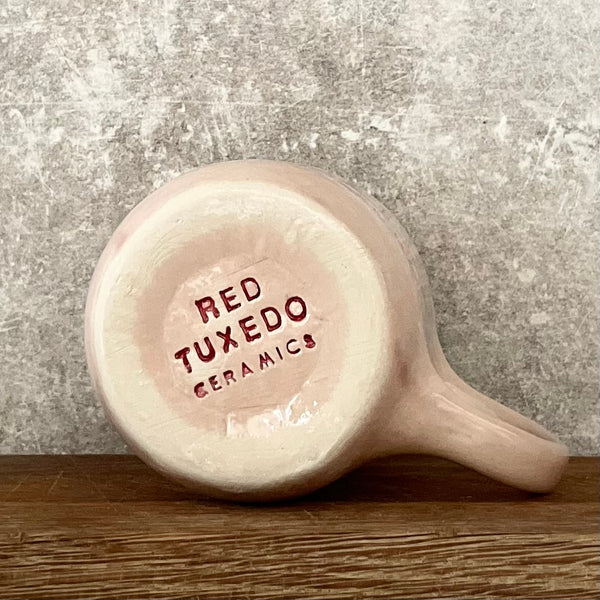 Rausvas puodelis ŠAMPANO