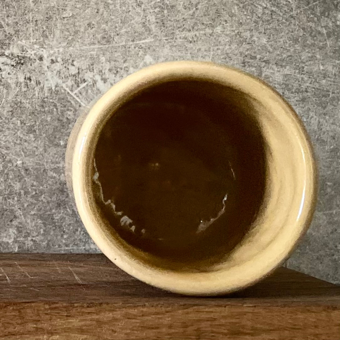 Yellow tumbler mug with word in Lithuanian POILSIS