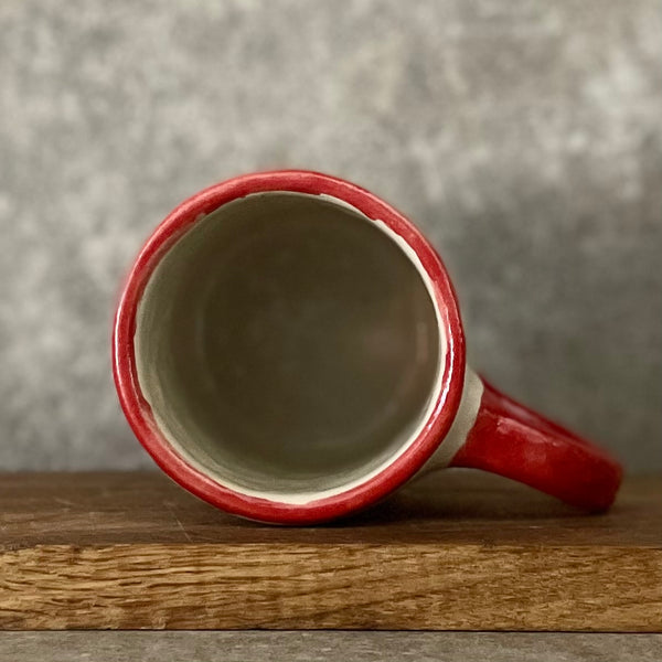 Puodelis su užrašu