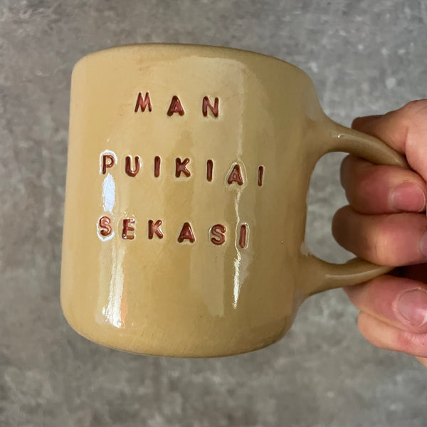 Yellow ceramic mug about luck