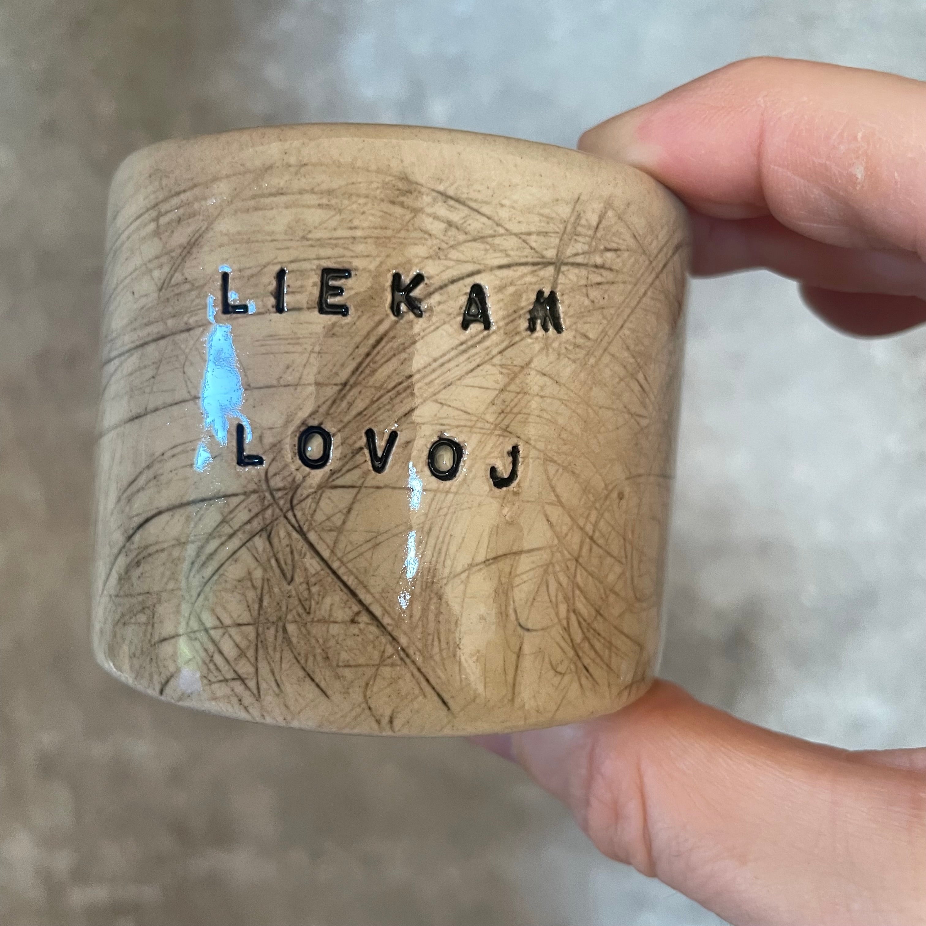 Set of two espresso mugs with words in Lithuanian