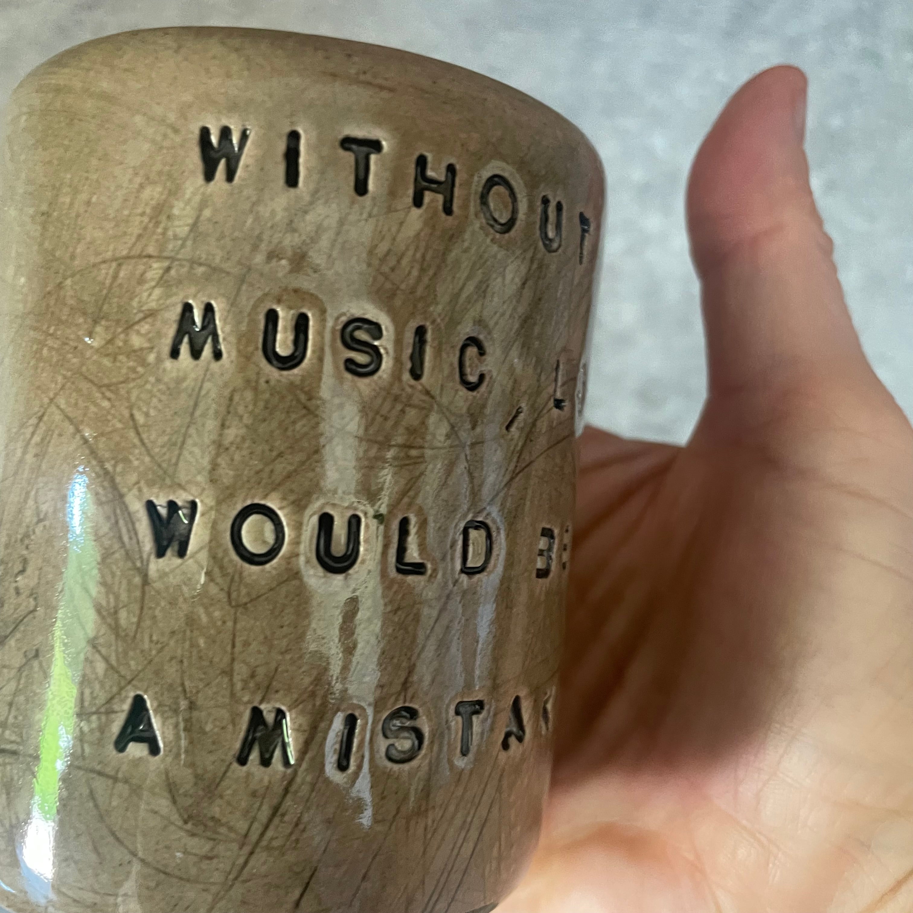 Brown mug with Nietzsche quote