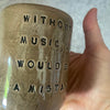 Brown mug with Nietzsche quote