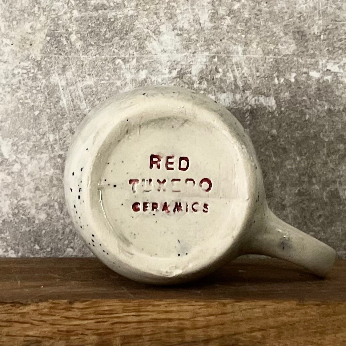 Speckled coffee mug with funny saying in Lithuanian