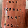 Red tumbler mug with magic saying
