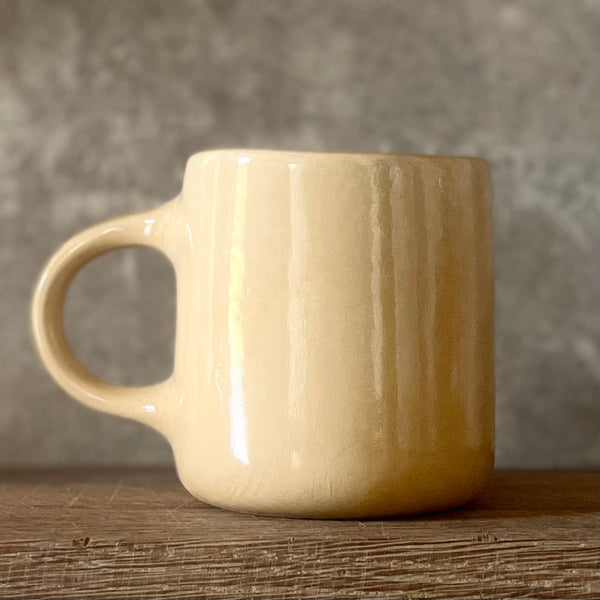 Yellow mug DARYK IR PADARYSI