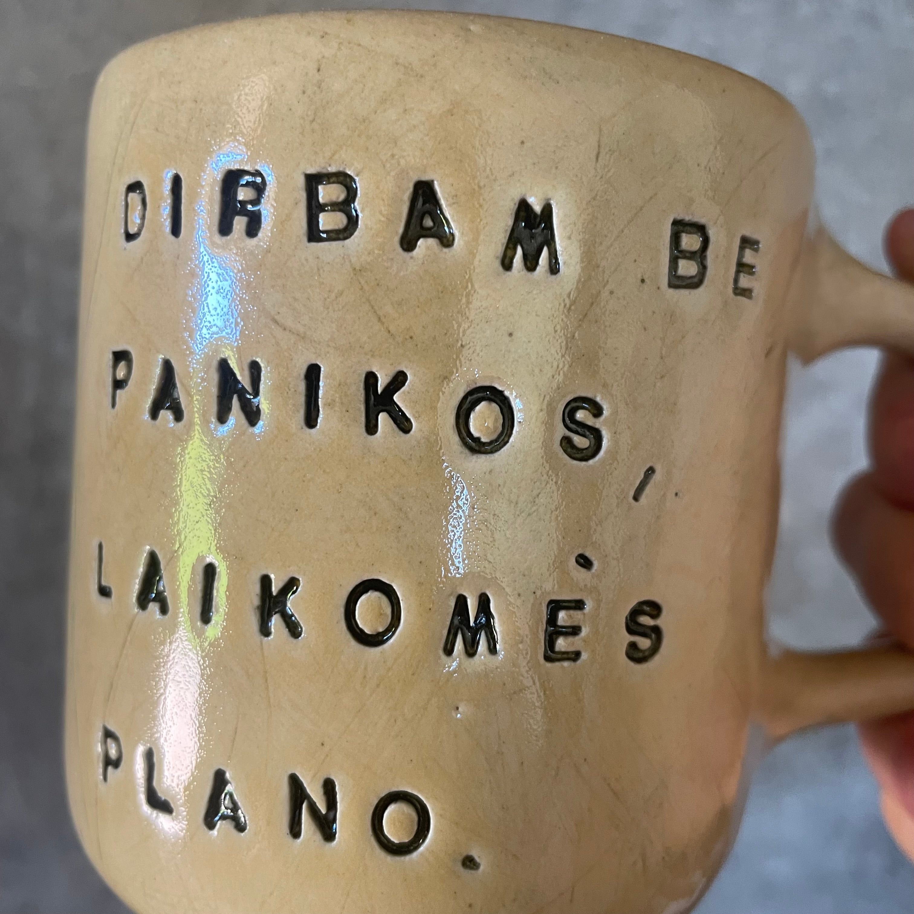 Yellow mug with words about work