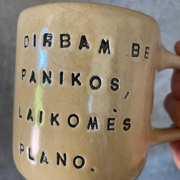 Yellow mug with words about work