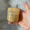 A pair of mugs with words in Lithuanian
