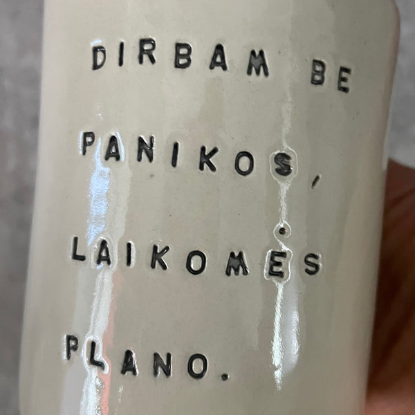 White mug without handle with saying about work