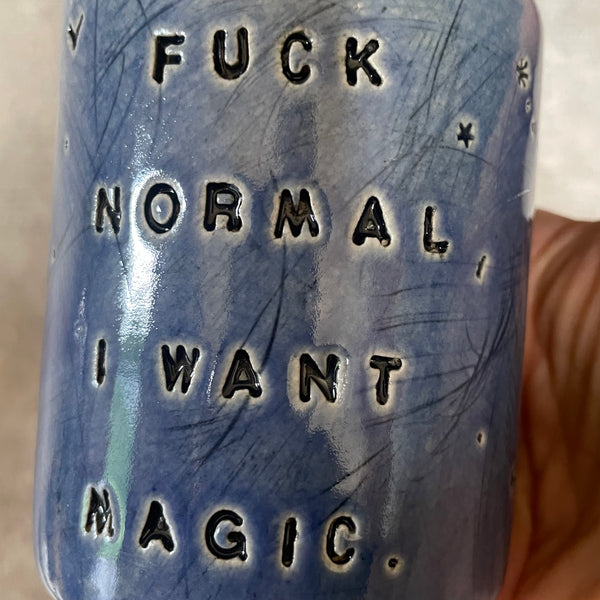 Deep blue mug with magic saying