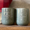 Set of small grayish mugs
