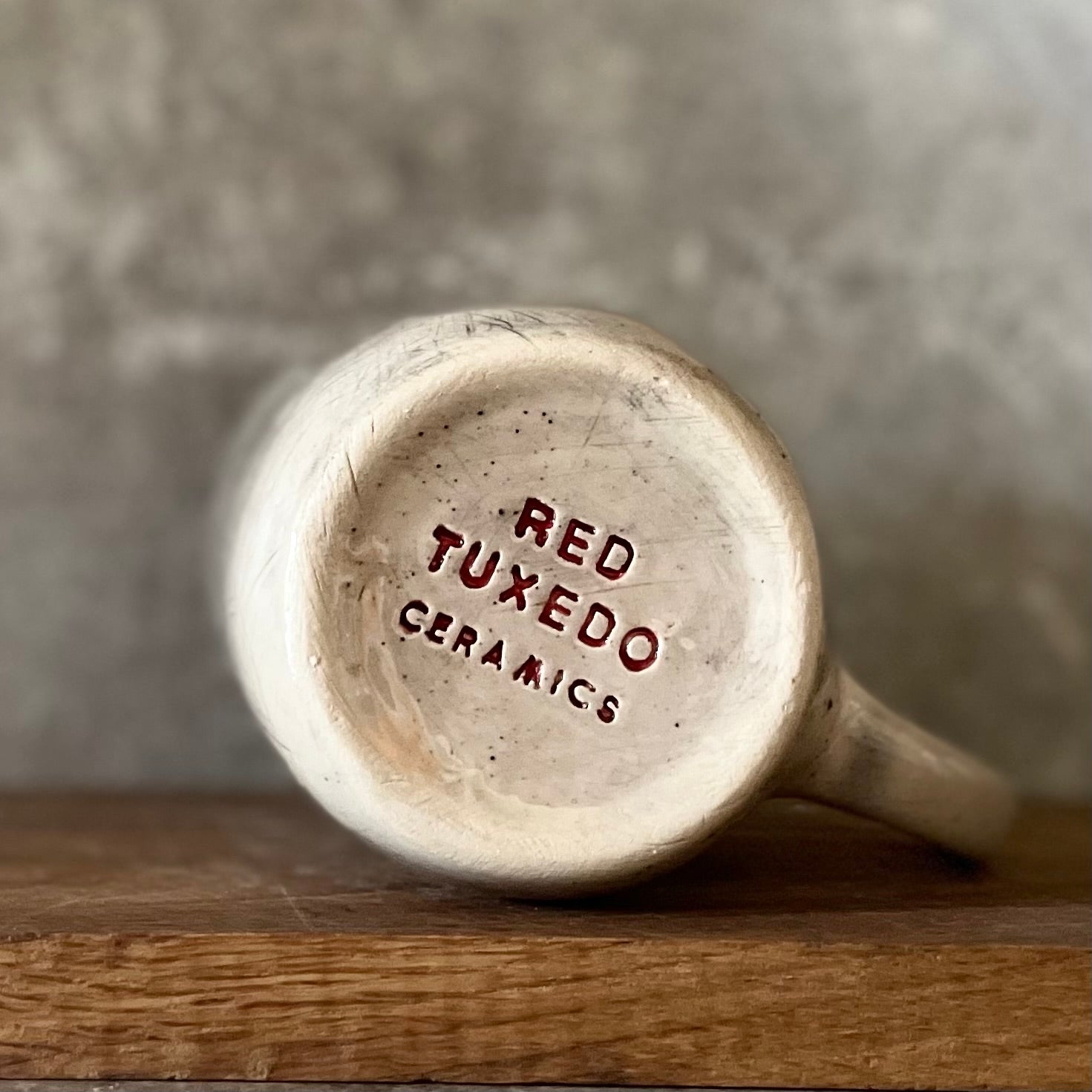 Speckled mug with words about work - another