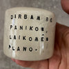 Small espresso mug with words about work