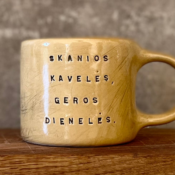 Yellow mug with good wishes