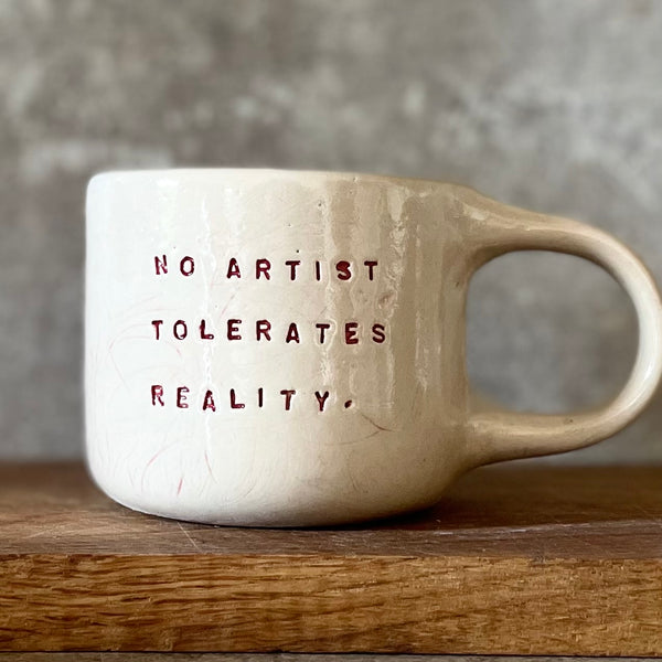 Mug with quote about artists