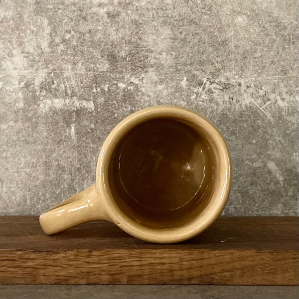 Yellow ceramic mug with quote by Vergil