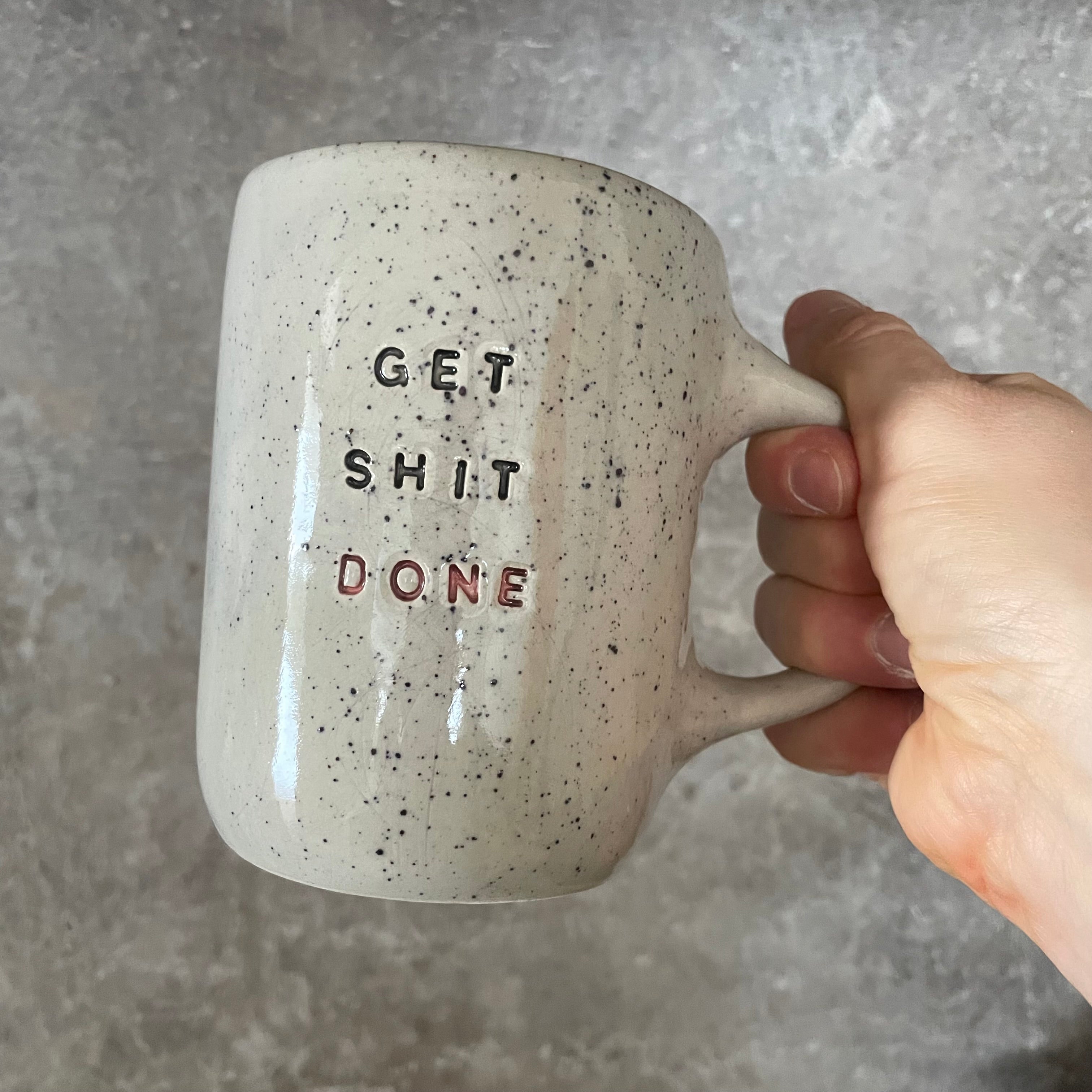 Cool ceramic mug with text GET SHIT DONE