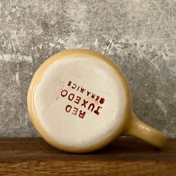 Yellow mug with words in Lithuanian