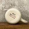 White medium ceramic mug with words about work