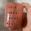 Red tumbler mug with magic saying
