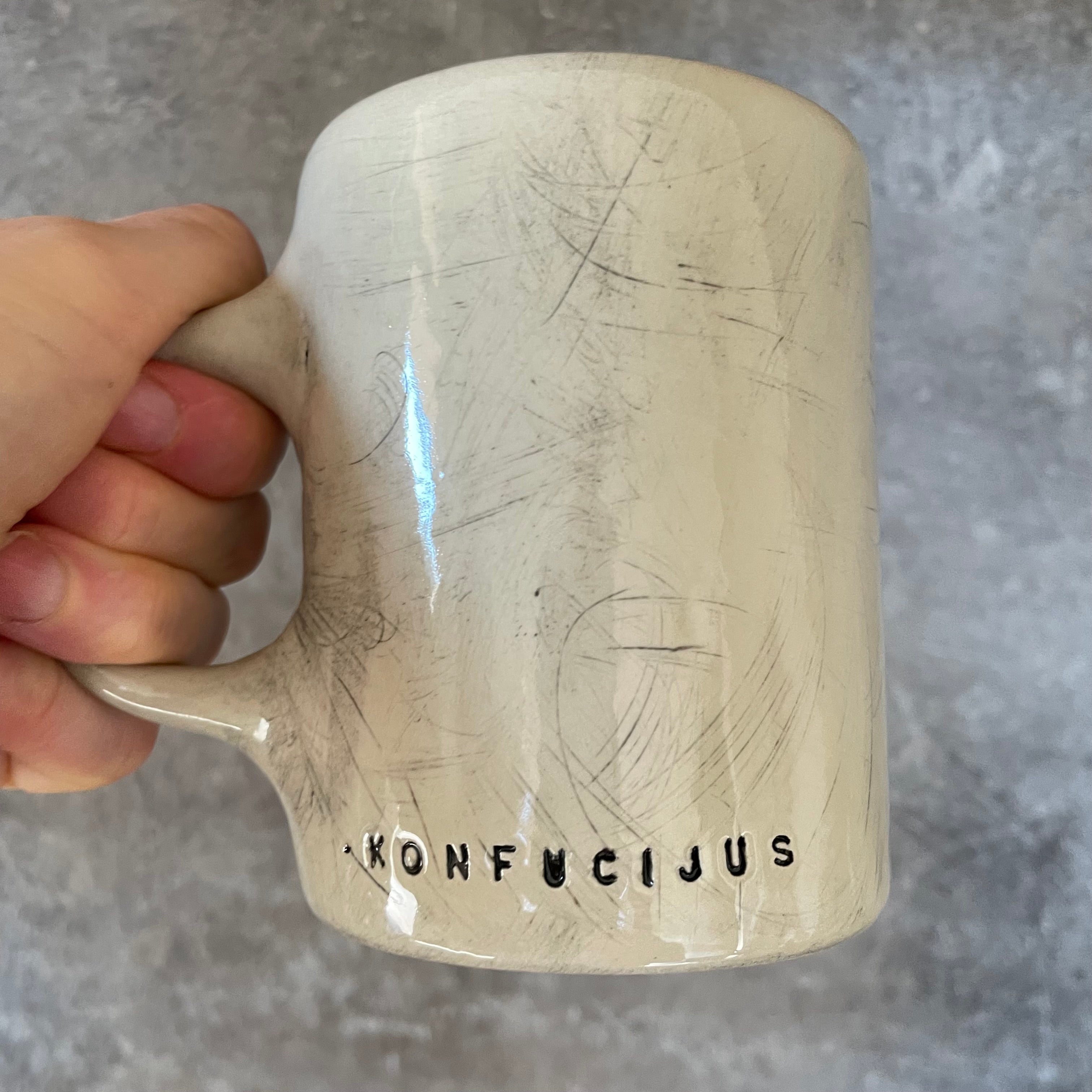 Puodelis su Konfucijaus citata
