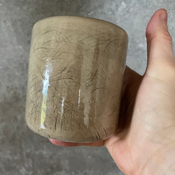 Beige tumbler mug with word RAMYBE