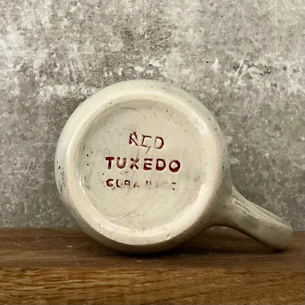 Speckled mug with words about work