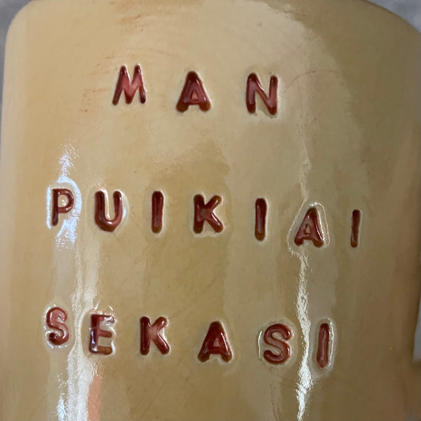 Yellow ceramic mug about luck