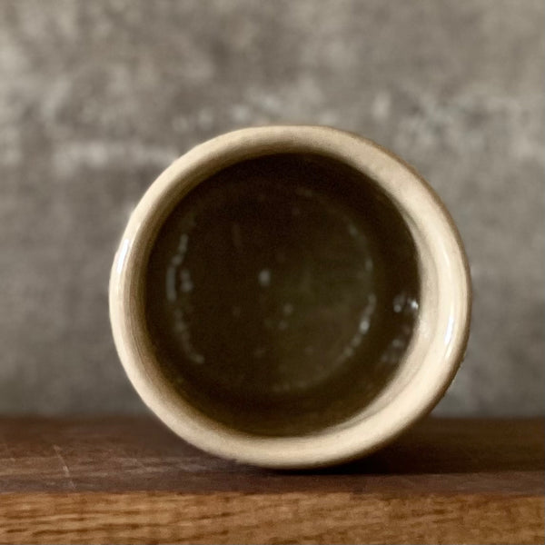 Beige tumbler mug with word RAMYBE