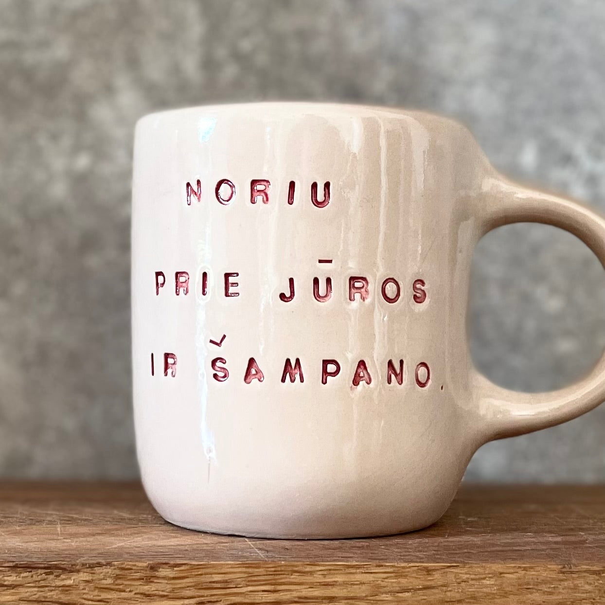 Pink mug with saying in Lithuanian