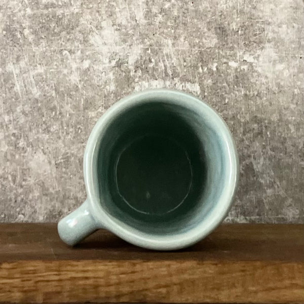 Small blue mug with words in Lithuanian