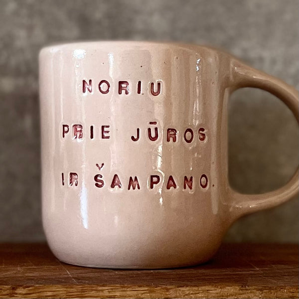 Pink big mug with saying in Lithuanian