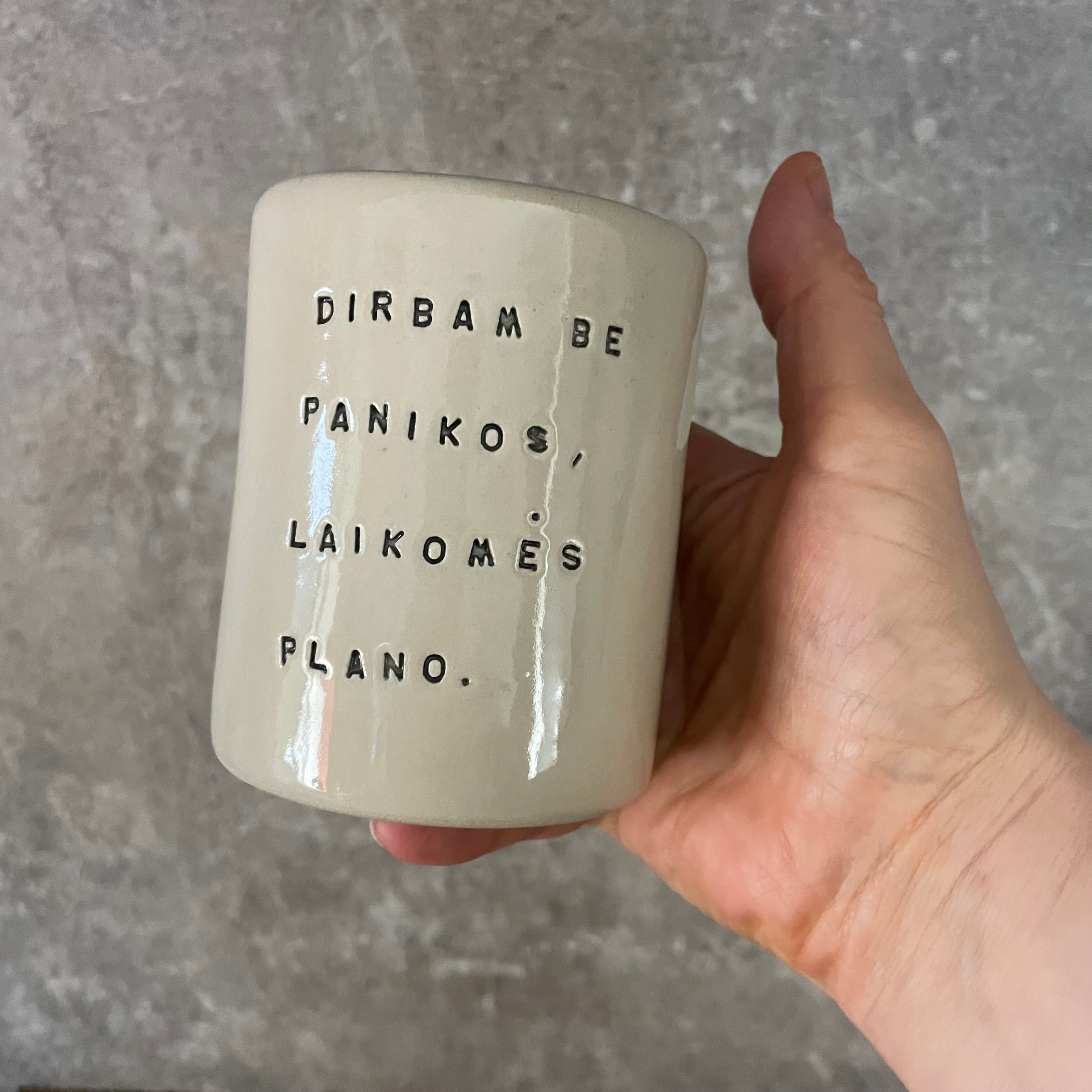 White mug without handle with saying about work