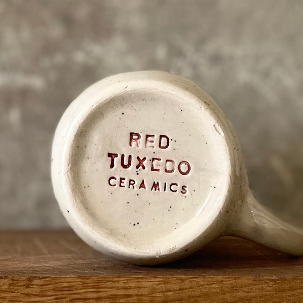 Speckled mug with saying in Lithuanian