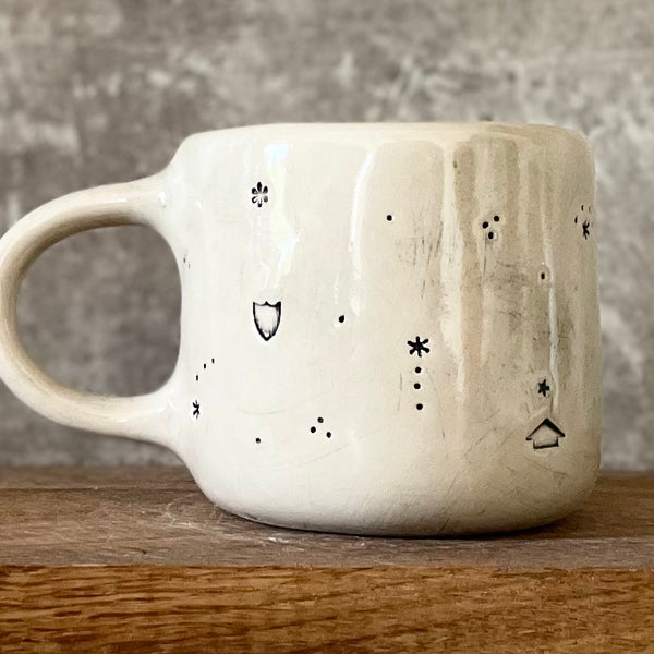 Ceramic mug with saying about magic