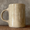 Brownish mug with funny saying