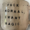 Ceramic mug with saying about magic