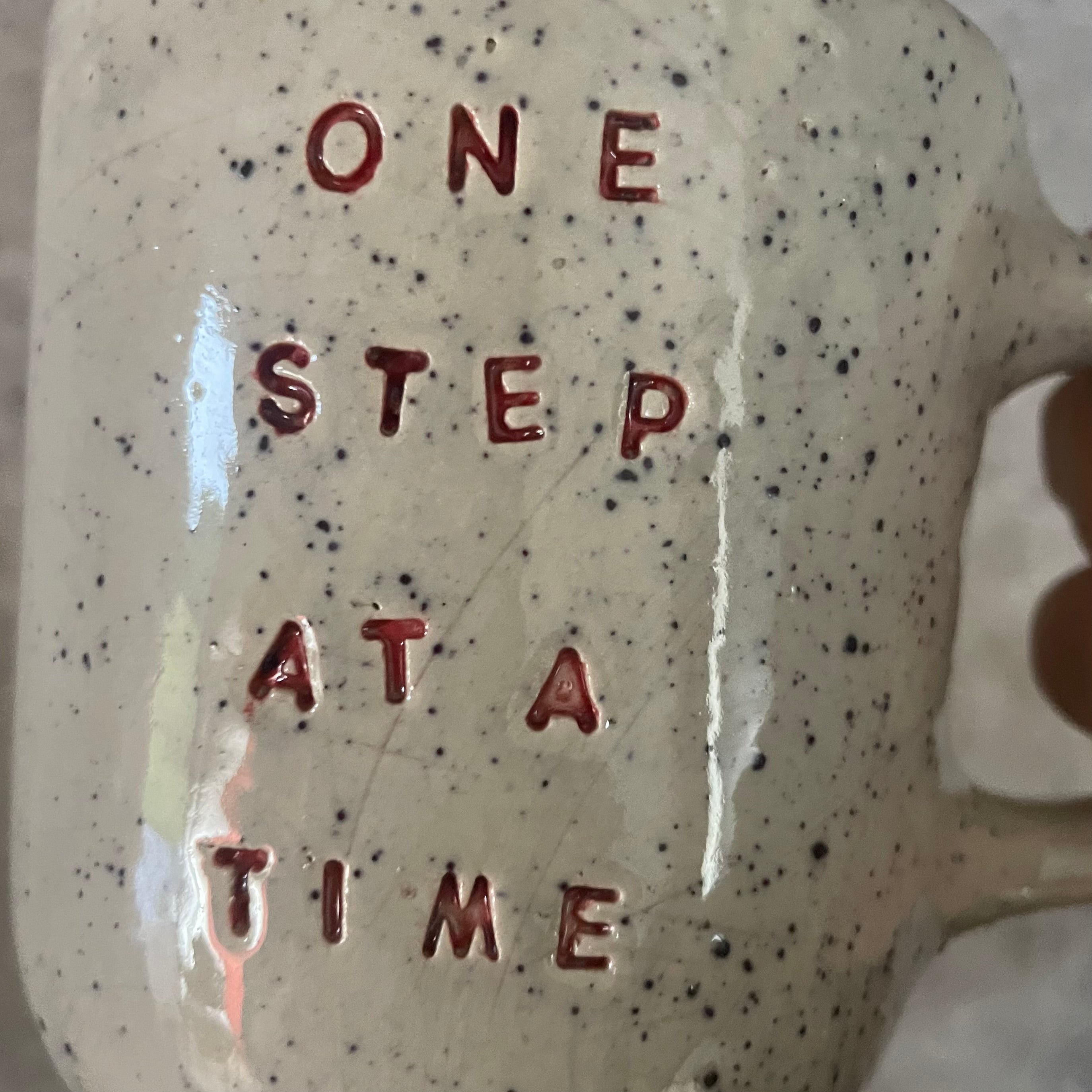 Off-white mug ONE STEP AT A TIME