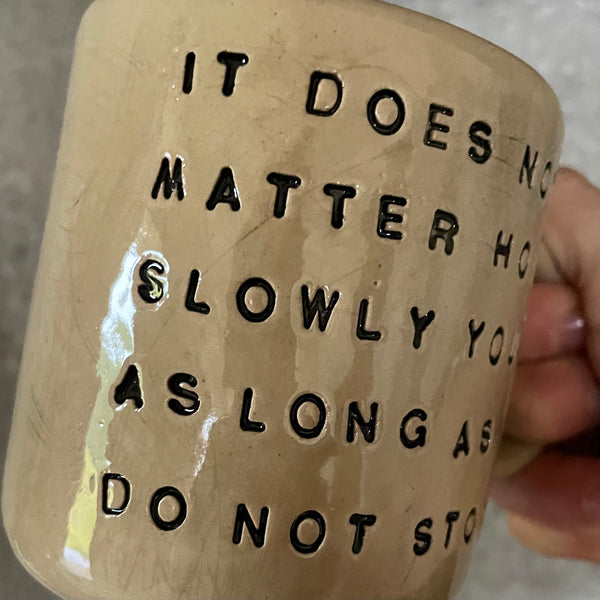 Beige mug with quote by Confucius