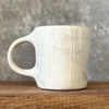 Ceramic mug with saying about balance with handle