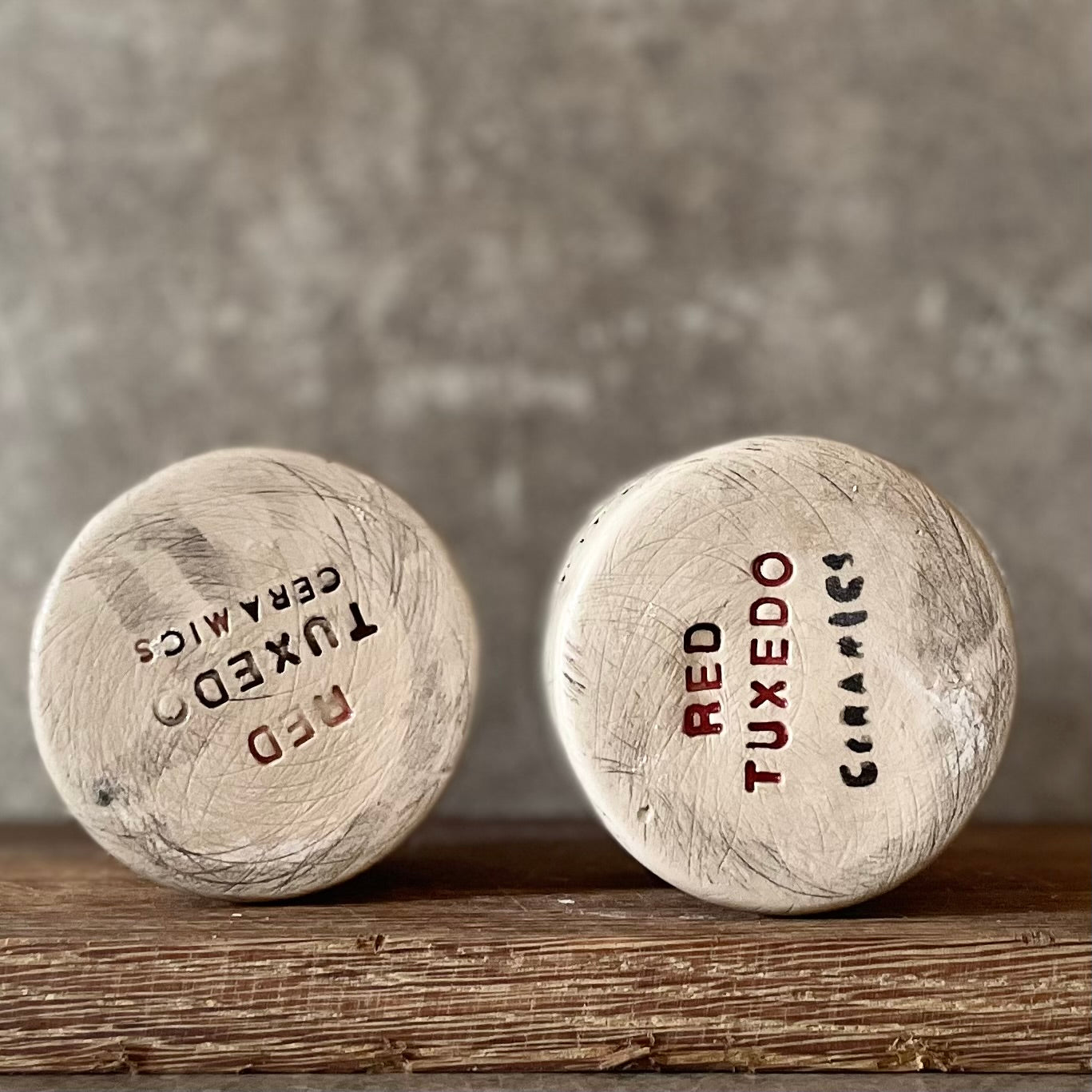 A set of small mugs with words in Lithuanian