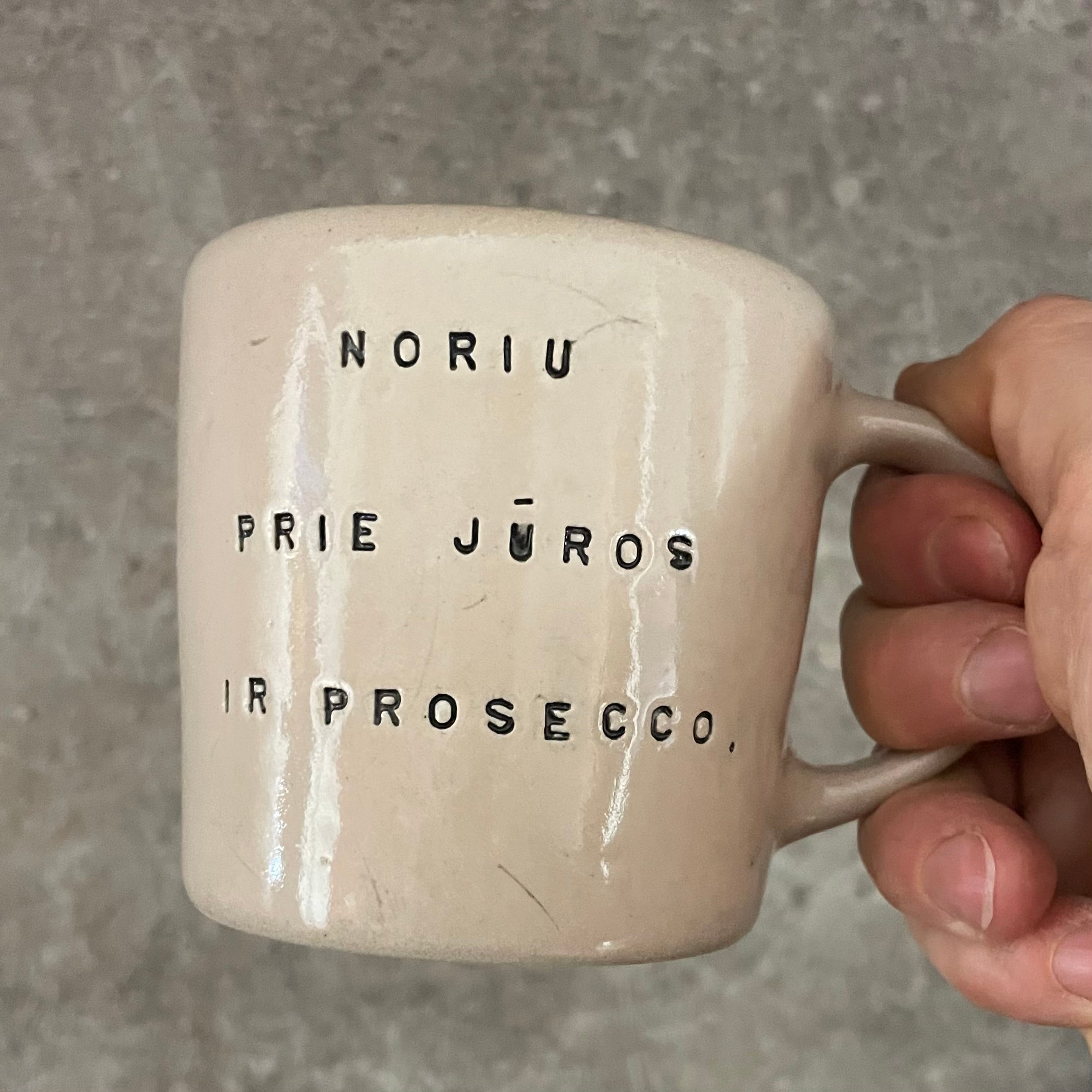 Pale pink mug with prosecco saying
